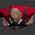 Man in Red T-shirt and Gray Overalls Wearing Gas Mask Standing Against Gray Background