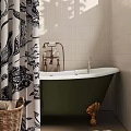Green Bathtub with Brass Faucet Black White Floral Shower Curtain and Tile Walls with Basket