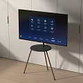 Smart TV Screen on Black Table with Gold Legs in White Cabinet Modern Living Room