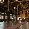Ancient Architecture Interior With Wooden Beams Stone Columns Traditional Lanterns And Red Carpet
