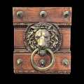 Vintage Brass Lion Head Door Knocker On Wooden Door Panel With Decorative Metal Rivets