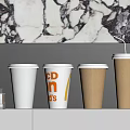 Branded White and Brown Paper Cups with CPN D's on White Shelf against Marble Wall