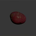 Vibrant Red Potato With Smooth Skin And Oval Shape On Dark Background