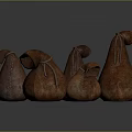 Brown Pear Shaped Textured Cloth Bags With Drawstring Closure In Various Sizes On Dark Background