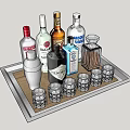Various Alcohol Bottles And Glasses On Stylish Bar Tray With Shaker