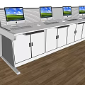 Efficient Office Desk With Four Computer Monitors Keyboards And Cabinet Doors
