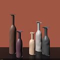 Modern Ceramic Vases In Various Colors With Orange Background And Different Heights