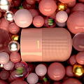 Pink Bluetooth Speaker With Modern Design Surrounded By Colorful Decorative Balls