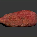 Red Cocoa Pod With Textured Surface And Dark Spots On Black Background