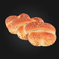 Freshly Baked Braided Bread With Golden Brown Surface And Sesame Seeds