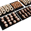 Baked Goods Assortment with Donuts Croissants and Rolls on Black Trays