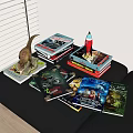 Stacked Sci Fi Adventure Books With Dinosaur And Rocket Models On Table 3d model