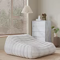 White Quilted Bean Bag Chair in Modern Room with Window Blinds Table Lamp and Dresser