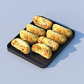 Golden Baked Pastries on Black Tray with Toasted Surface and Seasoning