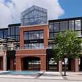 Modern Commercial Street Architecture With Glass Curtain Walls Red Brick Elements Green Plants And Square