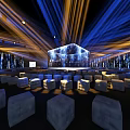 Modern Event Venue With Large LED Stage And White Cube Seats Under Blue Lighting