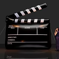 Art Installation Featuring Giant Clapperboard Miniature Figure And Dog Design Elements