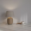 Ceramic Base Table Lamp With Fabric Lampshade And White Tray Coffee Cup Cookies On Table