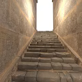 Modern Stone Staircase Design With Hieroglyphic Walls And Natural Light Streaming Through