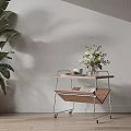 Side Table With Wooden Top Metal Frame Wheels Green Plant Vase Cups Cookies And Book