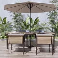 Outdoor Wooden Deck Dining Set With Wooden Table Woven Chairs Green Plants And Large Umbrella