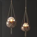 Rustic Rope Wrapped Glass Globe Chandeliers Illuminated Against Dark Wall 3d model