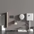 Toilet with Gray Wall Urinal Sink Toilet Paper Holder Soap Dispenser and Trash Can