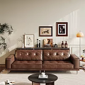 Brown Leather Two Seater Sofa in Living Room with Decorative Paintings and Floor Lamp