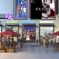 Bustling Commercial Street With Luxury Brand Stores Outdoor Seating And Shoppers