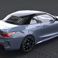 Light Blue BMW Convertible Sports Car With Black Roof And Blue Accented Wheels