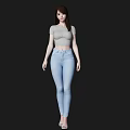 Woman in Gray Short Sleeve Top and Light Blue Jeans Standing Against Black Background