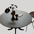 Black Round Dining Table Set With Two Chairs Plant Book And Cup