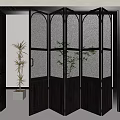 Modern Black Folding Door with Glass Panels in Interior Space and Green Plants
