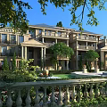 Classic Townhouse Exterior Design With Balconies Lush Greenery And Garden Railing