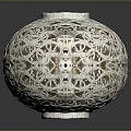 Intricate Spherical Sculpture Carving With Hollow White Patterns And Detailed Design