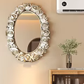 Elegant Oval Mirror With White Gold Rose Carved Frame And Green Plant On Wooden Cabinet