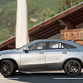 Silver Mercedes Coupe SUV Parked On Road With Scenic Mountain View