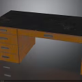 Wooden Desk With Black Top And Three Drawers Featuring Metal Handles