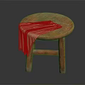 Round Wooden Stool with a Beige Cloth Draped Over the Seat and Solid Legs