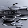 Stainless Steel Kitchen Cookware Set With Frying Pans Spatula And Glass Lid On Stove Top