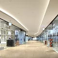 Modern Shopping Mall Hall With Glass Storefronts Mannequins And Bright Lighting