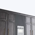Dark Gray Wooden Kitchen Cabinets With Brass Handles And Built In Double Ovens