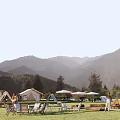 Scenic Mountain View Campsite With Tents Green Lawn And Outdoor Seats