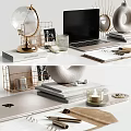 Organized Desktop Setup With Stacked Magazines Smartwatch Globe Laptop Photo Frame And Decorative Candles