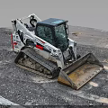 White Tracked Skid Steer Loader Parked On Gravel Construction Site With Front Metal Bucket