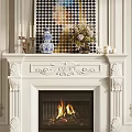 Classic White Carved Fireplace Mantel With Blue White Vase Flower Arrangement And Candles