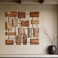 Wooden Wall Decor Featuring Various Sized Blocks In Grid Pattern With Vase
