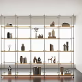 Modern Metal Frame Bookshelf With Multiple Shelves Decorative Sculptures And Books
