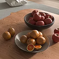 Fresh Red Apples and Sliced Oranges in Black Bowl and White Plate on Wooden Table