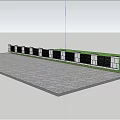 Building Exterior Wall with Gray Pillars Black Grilles Surrounded by Trees Grass on Gray Pavement